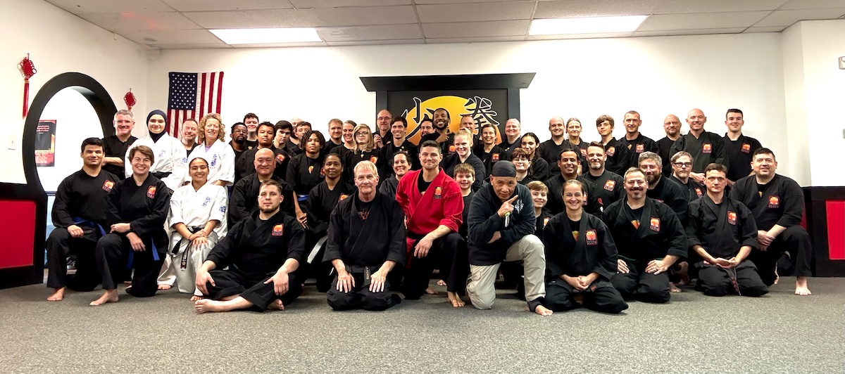 A group of adult martial arts seminar participants at Potomac Kempo Huntington.